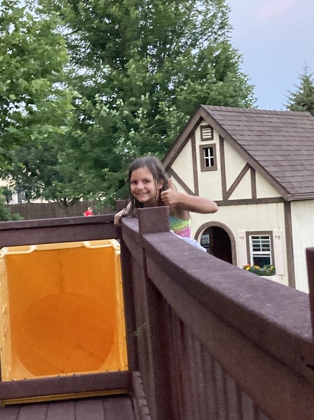 Greta Climbing the Slide at the Brewers.JPG